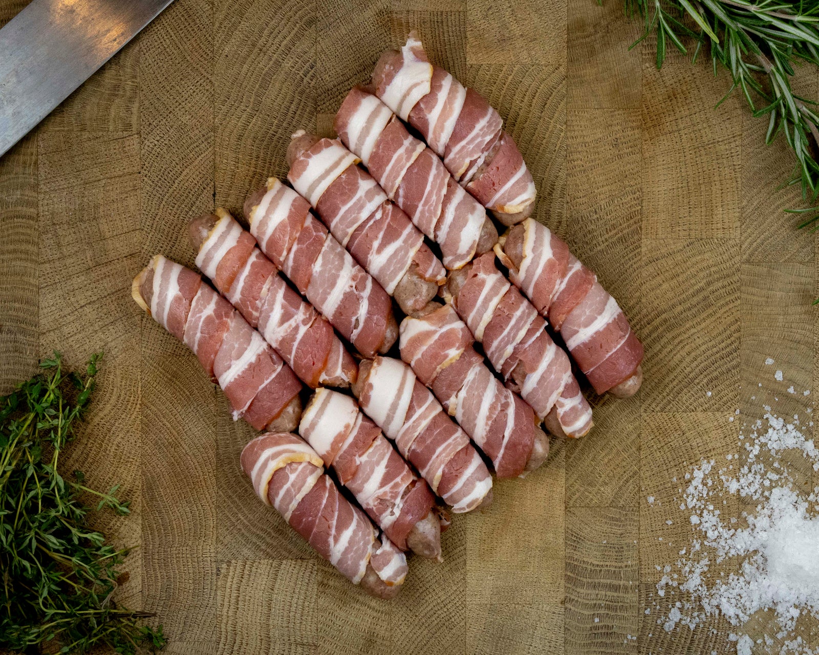 Pigs in blankets made with Blythburgh free range pork chipolatas wrapped in smoked streaky bacon