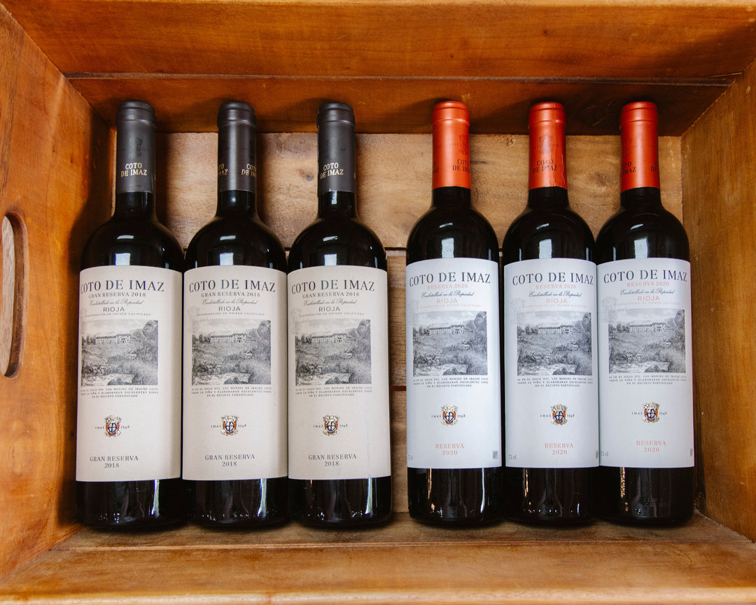 Coto de Imaz Gran Reserva 2018 Rioja red wine bottles in a wooden crate at Thomas Joseph Butchery